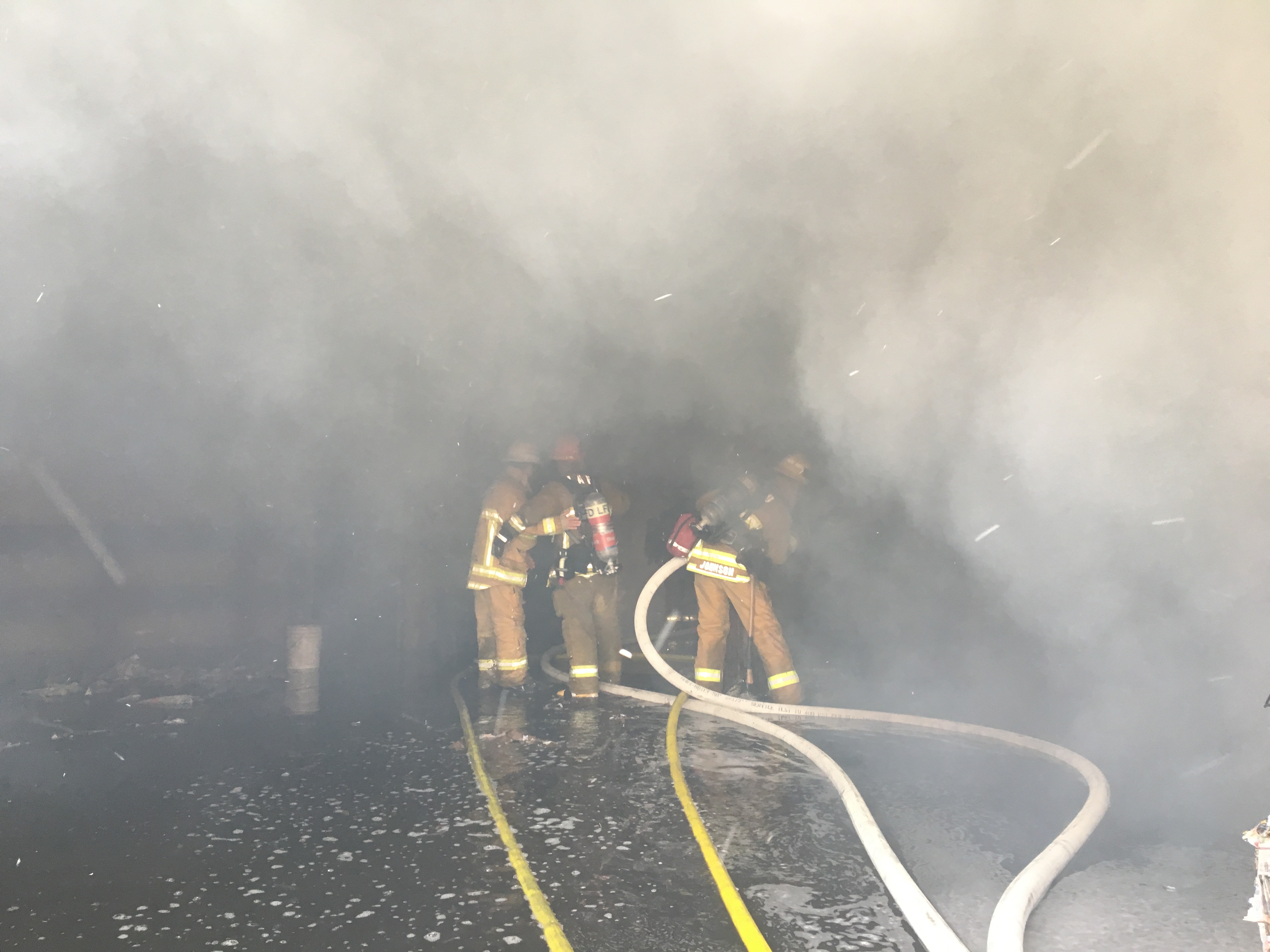 Los Angeles Firefighters inside burning paper recycling firm on October 5, 2017.