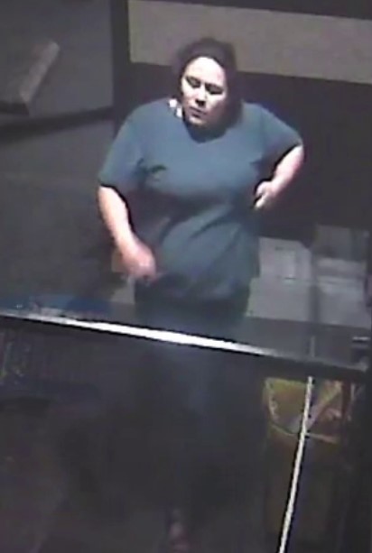 Screenshot of surveillance video showing female in blue shirt.