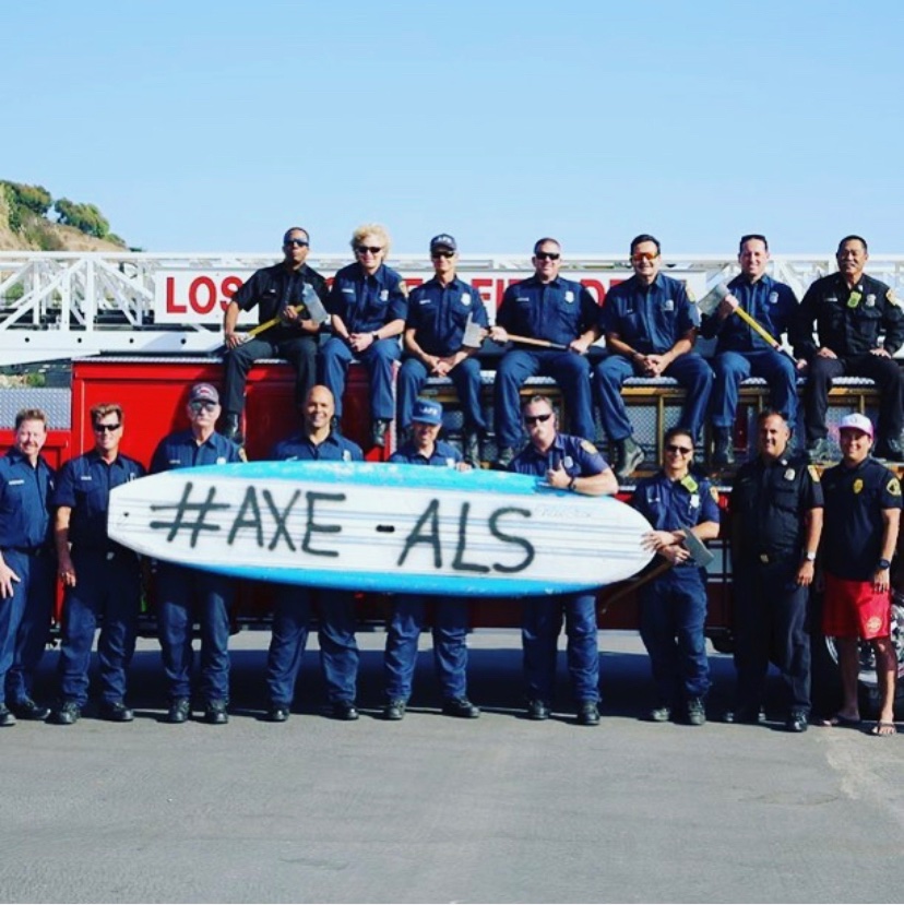Subject pictured with crew in front of fire truck raising awareness for ALS