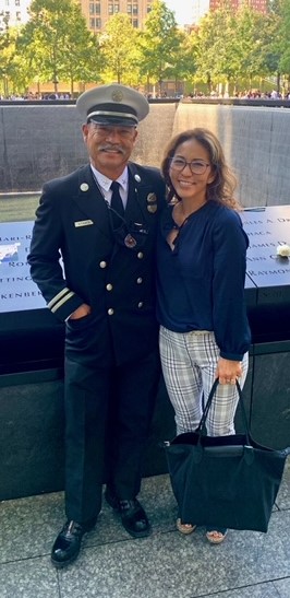 Subject with wife in front of 9-11 memorial