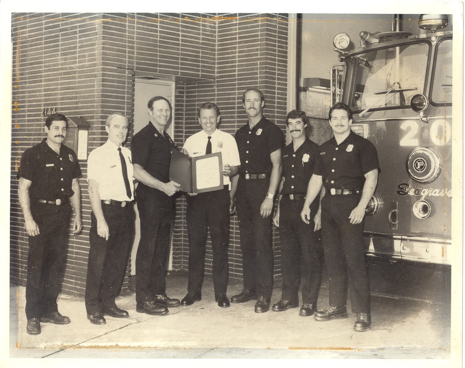 Group of firefighters with Frank Borden in the middle 
